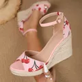 Close-up of pink cherry print wedge sandal with espadrille platform and ankle strap - 35 / Pink
