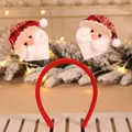 Close-up of festive Christmas headband with springy Santa Claus plush decorations - Plaid Santa Headband