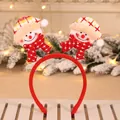 Close-up of festive Christmas headband with two plush snowman characters on springs - Plaid Snowman Headband