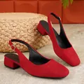 Close-up view of red suede slingback shoes with a stylish 3cm low block heel design. - 36 / Red