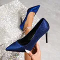 Detailed view of elegant blue glitter pointed-toe stilettos featuring high stiletto heels. - 35 / Blue