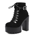 Close-up detail of black platform ankle boots featuring chunky heel and buckle strap - 35 / Black