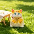 Adorable yellow and white kitten squishy toy for stress relief placed on green grass - S / Yellow Cat