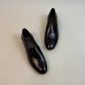 Top-down view of French style black leather loafers with chunky low heels on textured rug - 35 / Low Chunky Heel (3104-6) / Brown