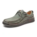 Detail of men's handmade leather loafers with breathable holes and contrast stitching - 46 / Green