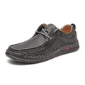 Close-up of black pebbled leather men's casual loafer with textured stitching and laces - Black
