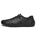 Men's black casual leather shoes featuring a unique octopus textured rubber sole design - 35 / Black