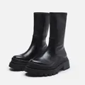 Side view of black mid-calf platform boots with chunky soles and elastic shafts - 35 / Black