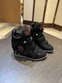 Detailed view of women's black high-top wedge sneakers with stars and velcro straps - 35 / Black