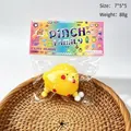 Detailed view of yellow chick squishy toy in packaging with size and weight info - Little Yellow Chick
