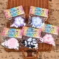 Set of five colorful cat paw-shaped stress relief squishy toys in retail packaging. - Flocked Cat Paw / Random Color
