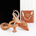 Detailed view of orange rhinestone high heel sandals and matching bucket bag set - 41 / Orange