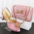 Pink snakeskin party shoes and matching square clutch bag set with rhinestone bow detail - Pink