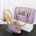 Detailed view of purple snakeskin pumps and matching handbag with rhinestone bow - 39 / Shoes and Bag Set / Light Purple