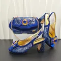 Detailed view of blue snakeskin high heels with matching rhinestone chain bag set - Blue