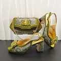 Detail view of olive green snake pattern high heels and matching rhinestone evening bag - Olive Green