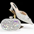Detail view of silver rhinestone wedding shoes and matching floral clutch set - 38 / Silver