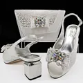 Elegant silver leopard print peep-toe sandals and matching rhinestone bow clutch bag set - Silver
