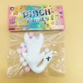 Detailed view of a white slow rebound squishy toy in swan shape with decorative pink pom-poms - Roast Duck (ZZMHT001) / White