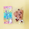 Slow rebound brown bear squishy stress relief toy in colorful Pinch Family packaging bag - Triangle Capybara