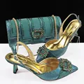 Elegant teal pointed toe heels and matching clutch bag with rhinestone buckles set. - Dark Green