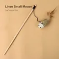 Interactive cat teasing stick featuring a linen mouse with feather tail and wooden pole - Linen Little Mouse