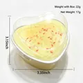 Heart-shaped yellow cake squishy toy with colorful sprinkles in a clear box - Heart Cake Style