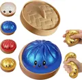 Detail view of glitter dumpling squishy toy being squeezed to show elastic texture - Glitter Dumpling Squishy / With Steamer Box / Blue