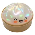 Primo piano di un simpatico squishy baozi con finitura iridescente e una faccina felice - Bianco Trasparente con Glitter