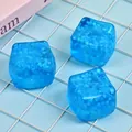 Close-up detail of blue snowflake-filled squishy ice cube toys on a light blue grid - Snowflake Series Cube (OPP Bag) / 4.50cm
