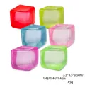 Set mit sechs farbenfrohen Squishy-Würfeln zum Stressabbau in leuchtenden Farben - Eiswürfel-Maltose