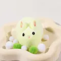 Yellow bunny squishy toy with soft fuzzy texture for stress relief in a decorative tray. - Little Rabbit (Yellow)