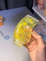 Gelber Zahnpasta-Quetschspielzeug zur Stressbewältigung mit Sternenglitzer-Effekt - Gelb