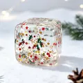 Detailed view of transparent Christmas squishy toy filled with festive glitter stars. - Rainbow Christmas (Sequin) / OPP Bag
