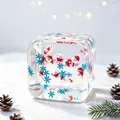 Detail shot of transparent Christmas squishy cube featuring Santa and blue snowflakes. - Style 1 (Santa Claus) / OPP Bag