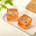 Juguete antiestrés squishy cubo tema océano con conchas marinas y purpurina de estrellas - Envase tipo bolsa / Naranja