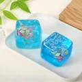 Stressverlichtend blauw kubus knijpspeeltje met oceaanthema en luxe schelpenglitters - Zakverpakking / Blauw