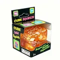 Juguete antiestrés cubo con conchas marinas, gel naranja y purpurina. - Envase tipo caja / Naranja