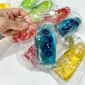 Vue détaillée de jouets squishy en forme de dentifrice avec des étoiles pailletées. - Style Myrtille