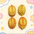 Detailed view of four durian-shaped slow rebound squishy toys for stress relief - Small Durian / Yellow