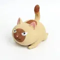 Detailed close-up of an angry cat squishy toy with soft texture and slow rebound - L / Yellow