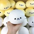 Cute white and yellow seal-shaped squishy toys featuring soft slow rebound decompression feel - Color Box / White