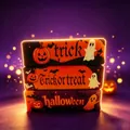 Close-up of Halloween-themed slow-rising squishy toys with pumpkin and ghost designs. - Halloween Cheese Stick Style