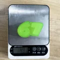 High-quality green 67 digit shaped TPR squishy toy for stress relief on a digital scale - Number 67 Shape / Light Green