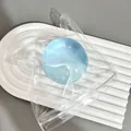Translucent blue coconut oil squishy decompression ball toy in a transparent bag - Blue