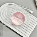 Pink translucent maltose squeeze toy ball for stress relief in a clear plastic bag - Pink