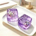 Detailed view of two purple ocean-themed maltose ice cube squishy toys on a tray - Purple