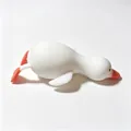 Detailed macro view of a white silicone squishy duck toy for stress relief and relaxation - White Duck