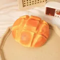 Close-up of a lava pineapple bread slow rebound squeeze toy with a realistic soft texture - Extra Large Pineapple Bun - Mango Pie Style