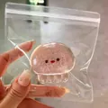 Mignon jouet à presser poulpe rose pailleté pour le stress dans un sac transparent - Bébé Méduse